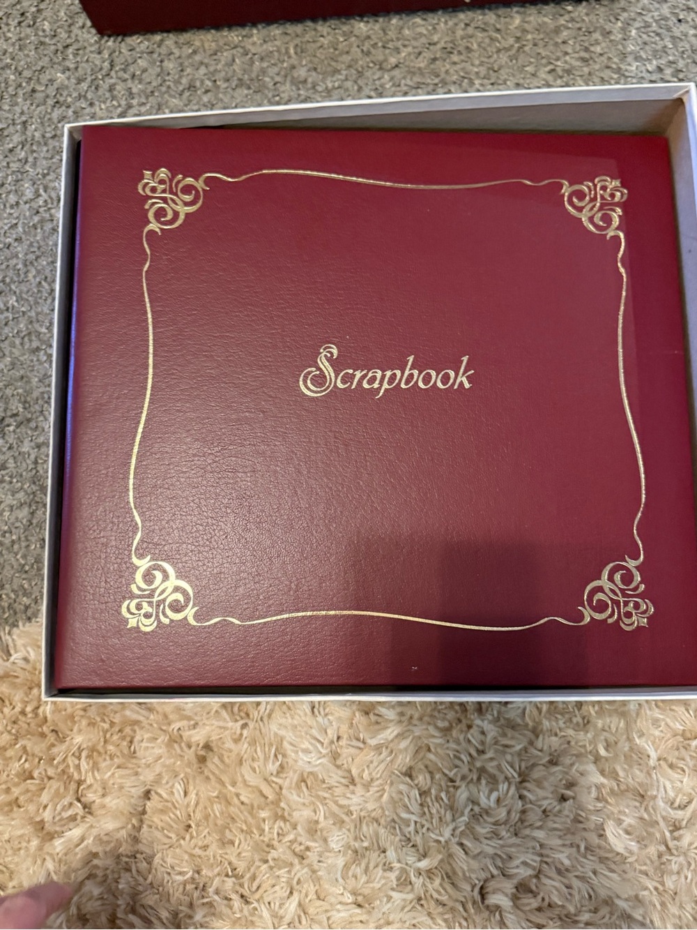 vintage maroon hardbound memory book labeled "Scrapbook" with box